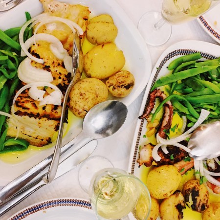 Traditional Portuguese food - bacalhau (dried cod), octopus, potato and green peas