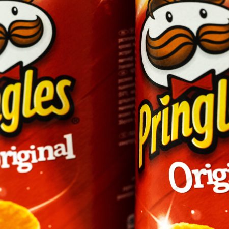 Cans of Pringles wheat-based stackable snack chips.