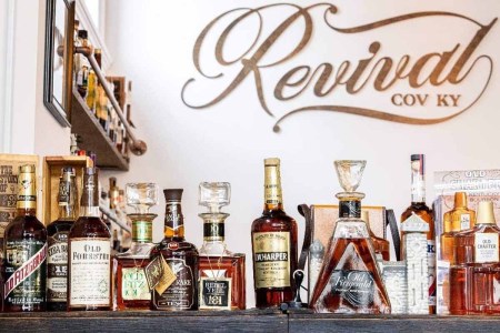 Some vintage bottles on a bar top at Covington, KY's Revival Vintage Spirits