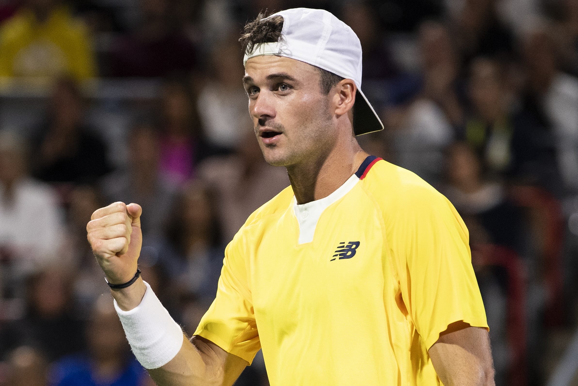 Tommy Paul of the United States celebrates winning a point.