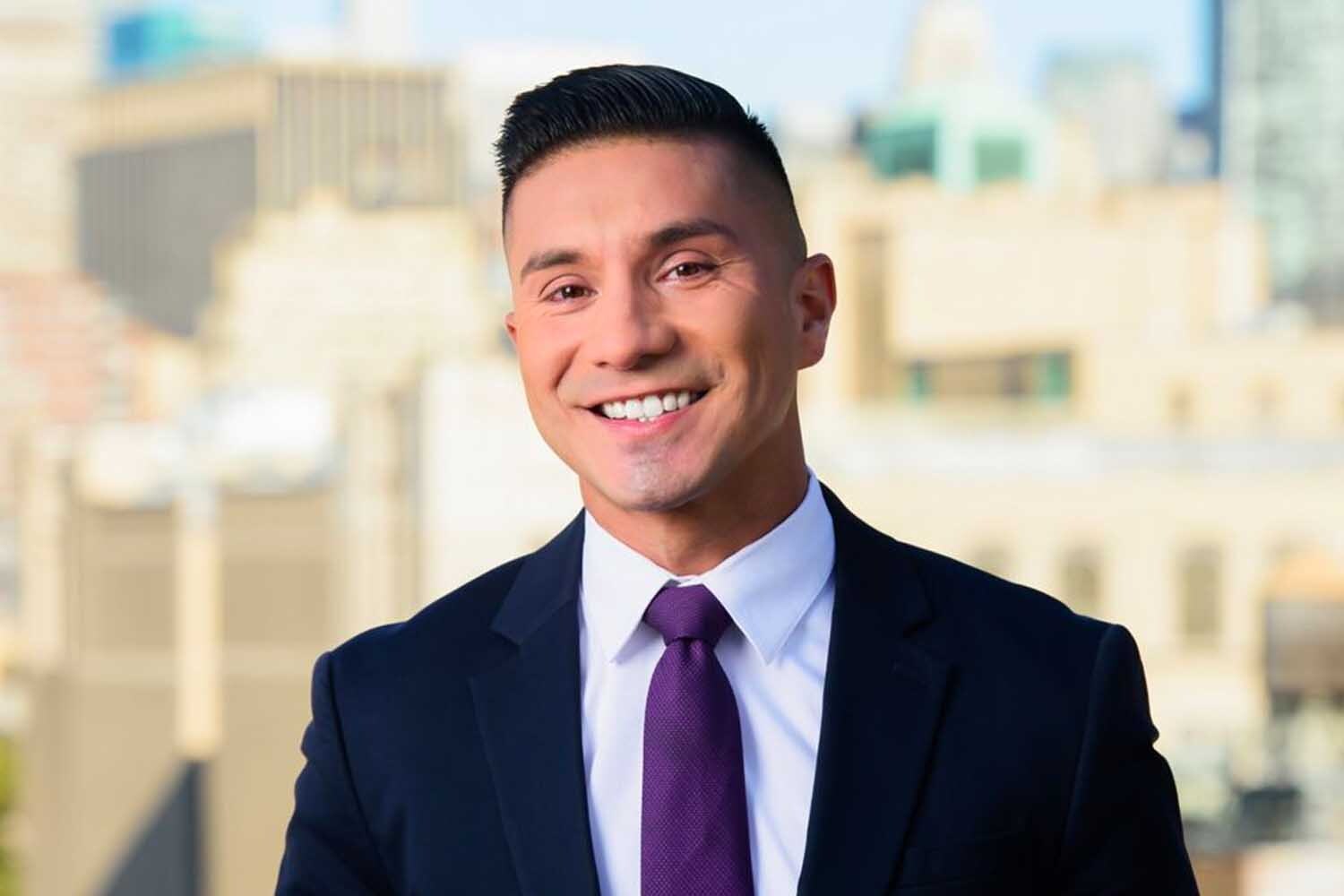 Erick Adame in front of a window