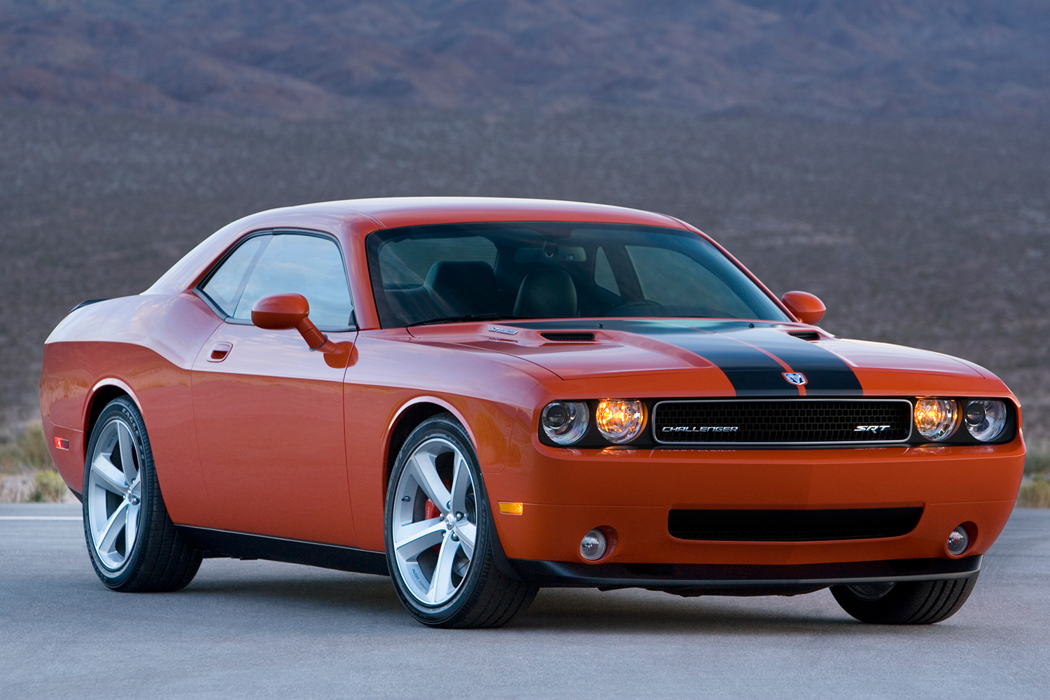 A 2008 Dodge Challenger SRT8 muscle car in orange and black