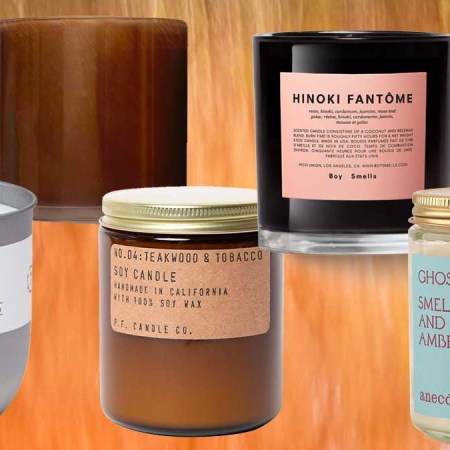 Fill Mill Last Drink By The Bonfire Candle, LAFCO Spiced Pomander, P.F. Candle Co. Teakwood & Tobacco Soy Wax Candle, Boy Smells Hinoki Fantome and  Ghosting by Antidote Candles, a few of the best fall candles for 2022 on an orange background