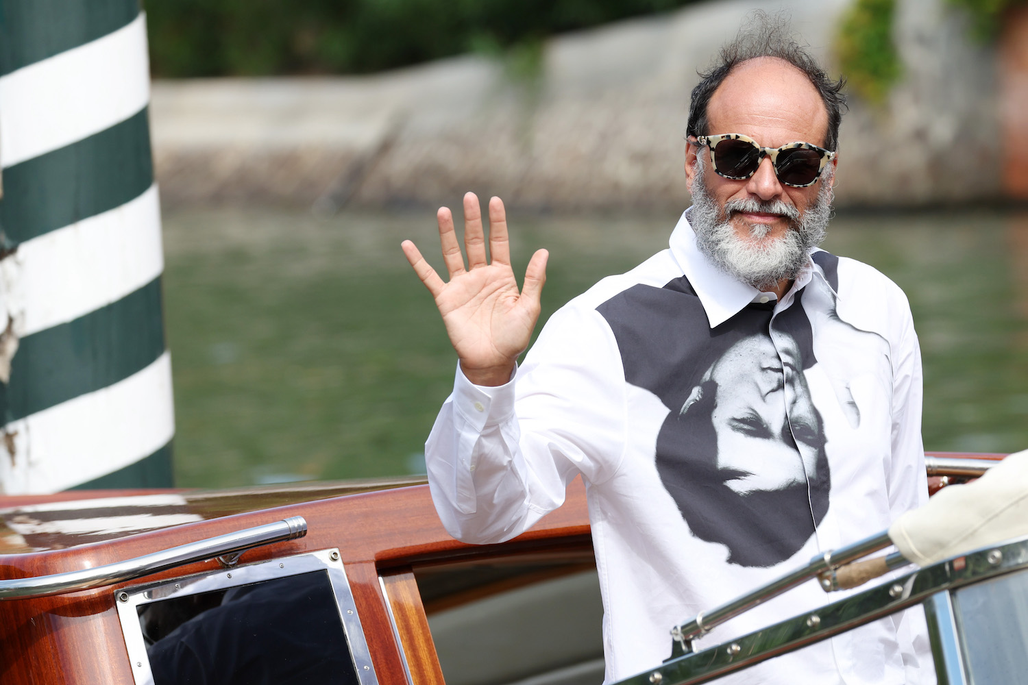 A red carpet photo of Director Luca at the 79th International Venice Film Festival