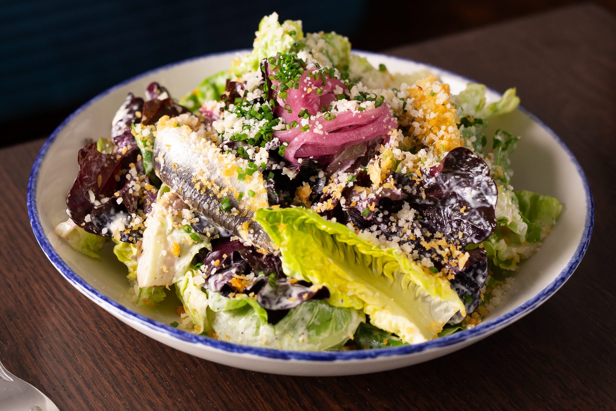 A Caesar salad made with little gem lettuce.