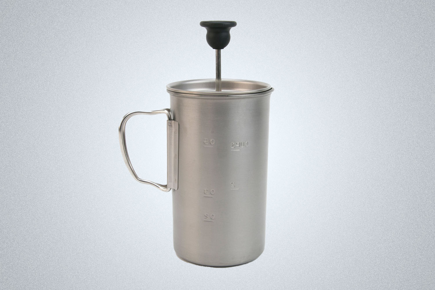 A Snow Peak Titanium French Press on a gray background