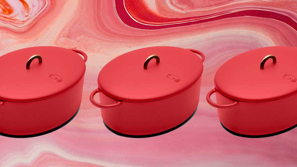 The Dutchess 6.75-Quart Enamel Cast Iron Dutch Oven with Lid on a red background