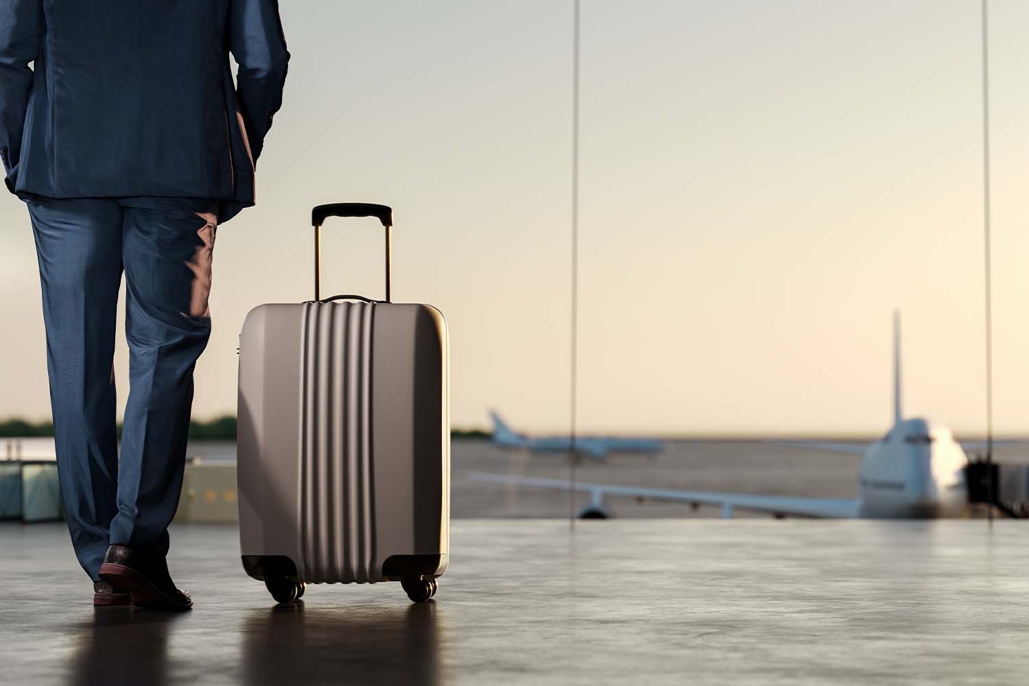 Businessman with carry-on at airport