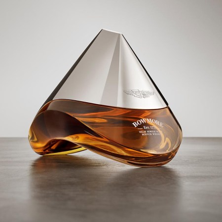 A bottle of Bowmore ARC-52, a collaboration with Aston Martin, on a table.