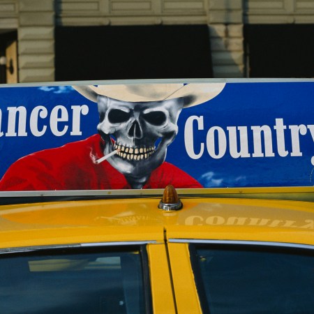 A taxicab with an anti-smoking advertisement.