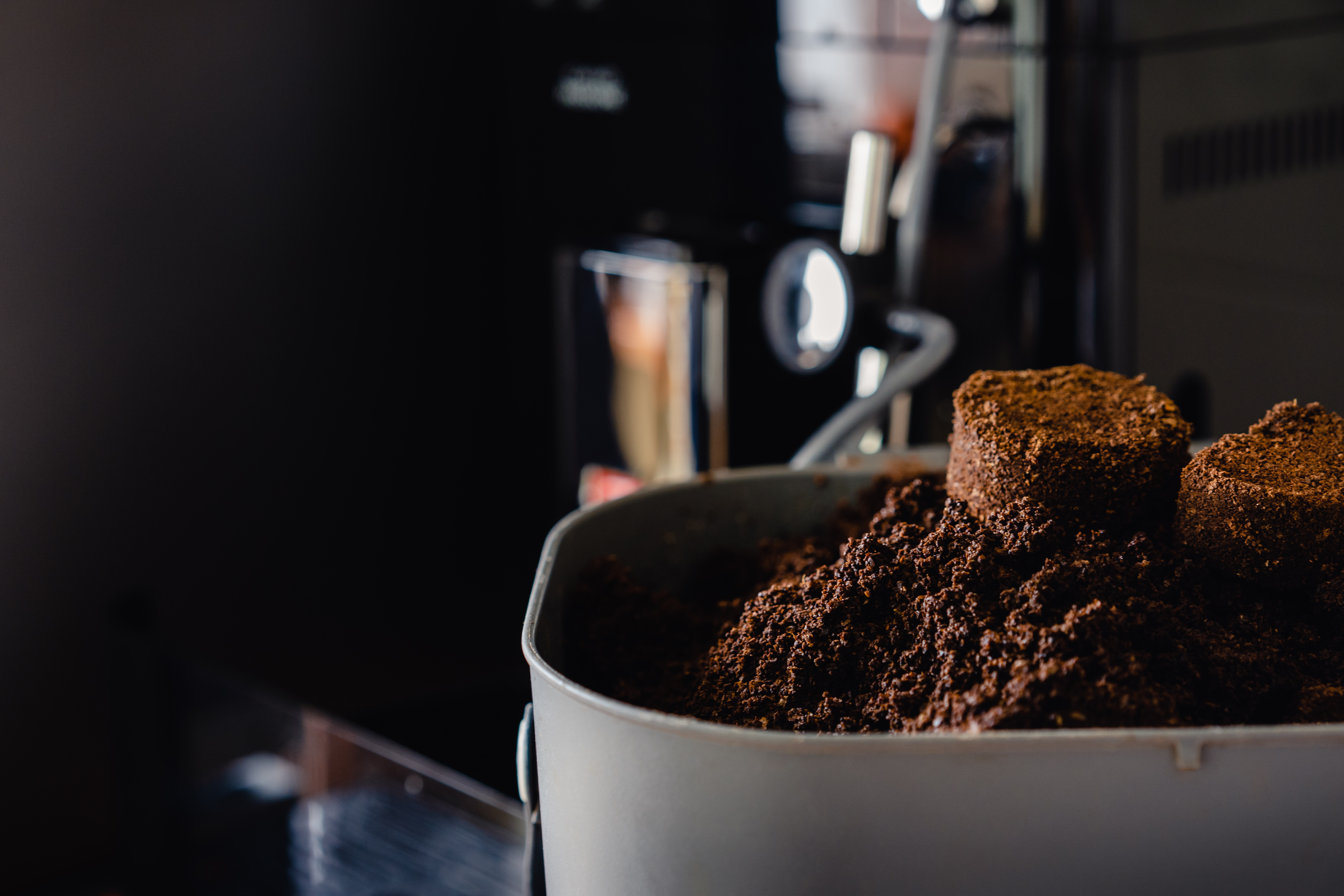 Leftover grounds resting in a pile on a coffee maker.