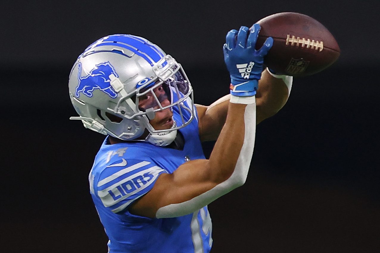 Amon-Ra St. Brown of the Lions catches the ball against the Washington Commanders.