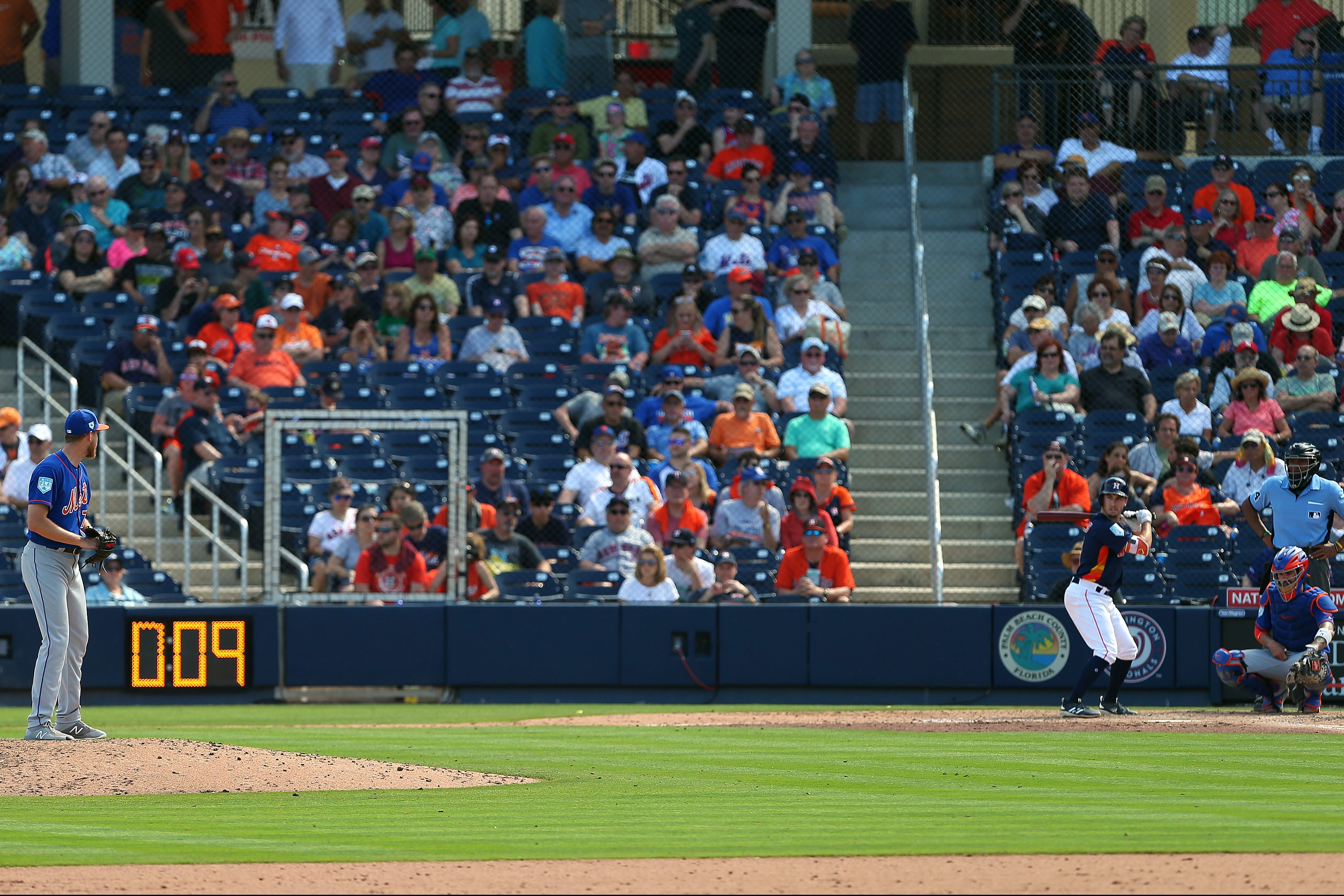 Eric Hanhold gets set to deliver a pitch as the pitch clock counts down.