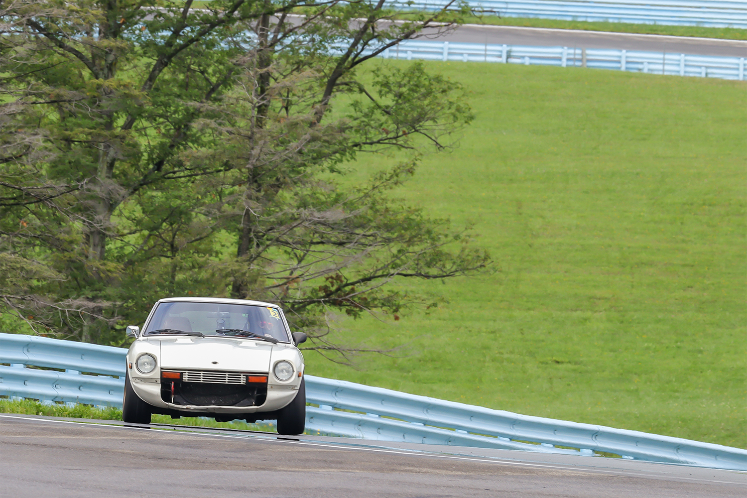 Benjamin Hunting climbing a hill at Watkins Glen in his 1978 Datsun 280Z race car