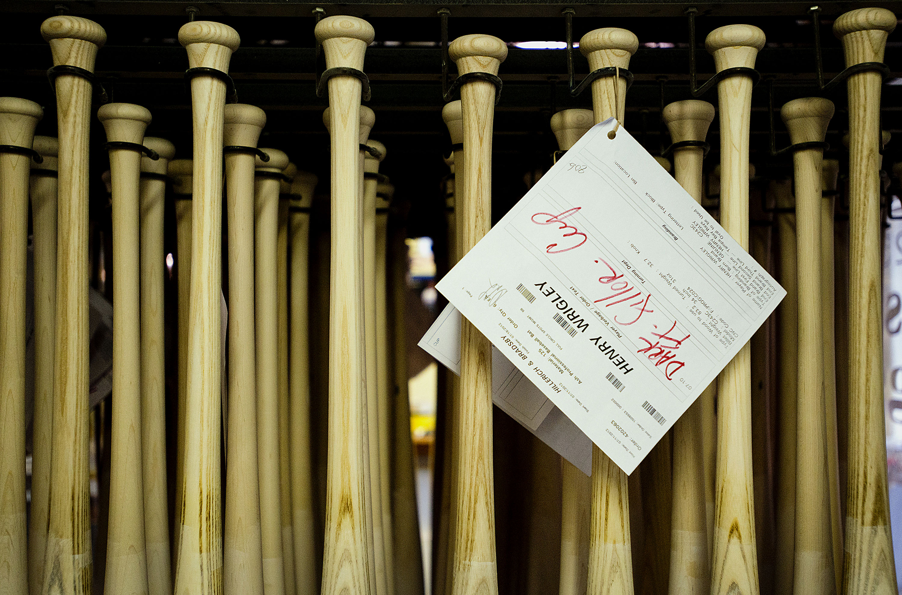 A row of Louisville Slugger baseball bats. The iconic ash bats are less popular than maple for a couple reasons.