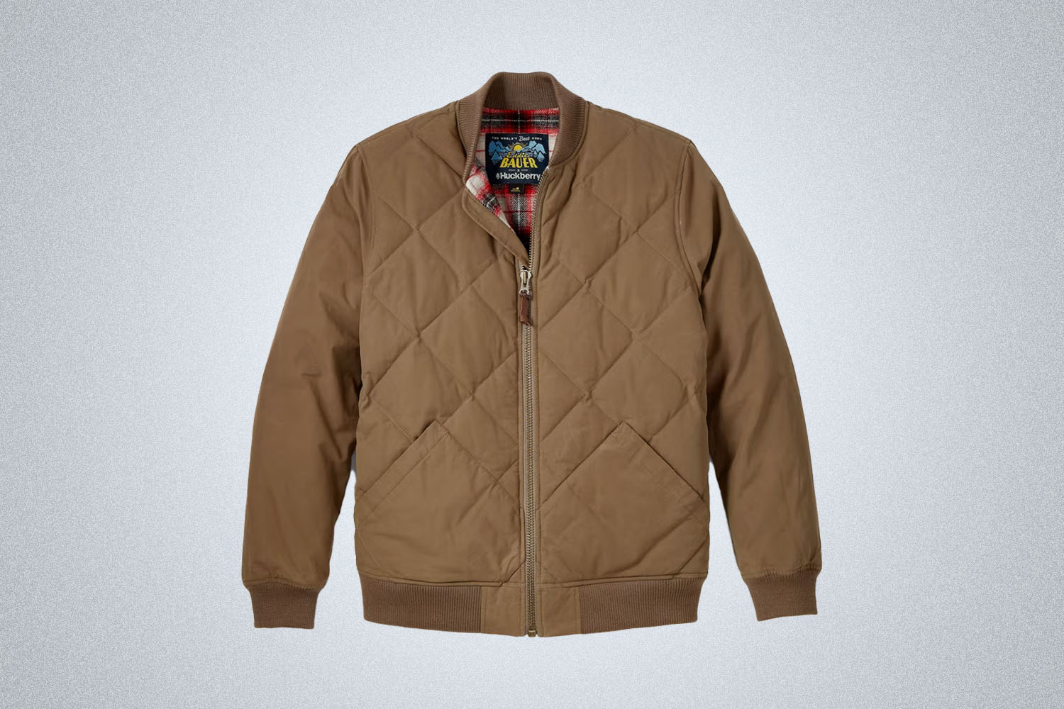 a Eddie Bauer x Huckberry Jacket on a grey background