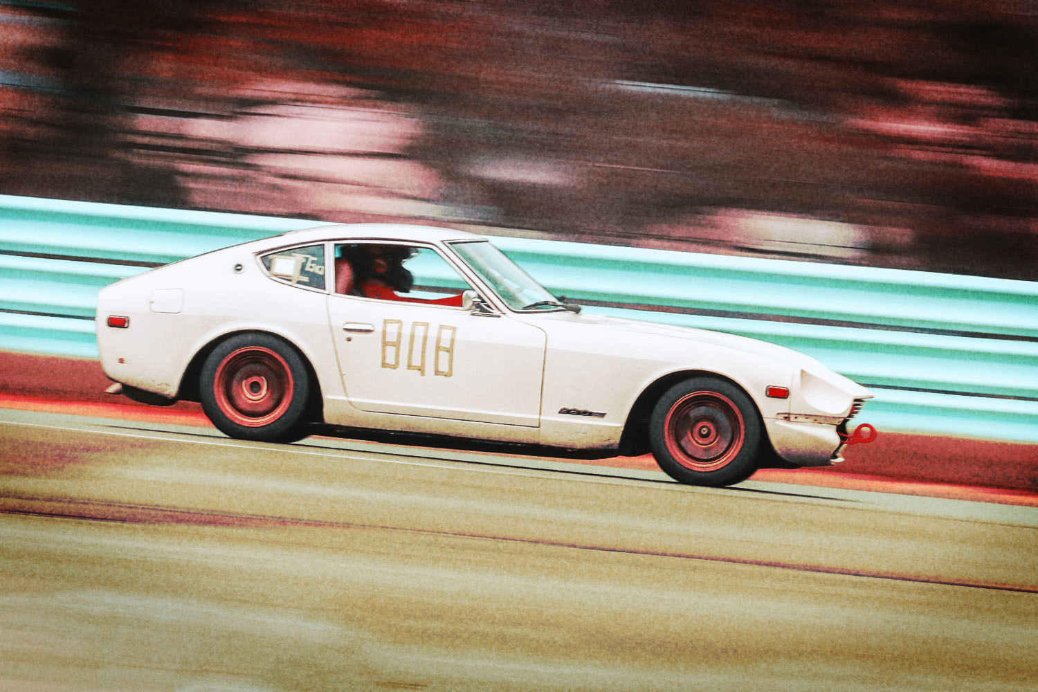 Car writer Benjamin Hunting drivers his 1978 Datsun 280Z race car on the racetrack at Watkins Glen International