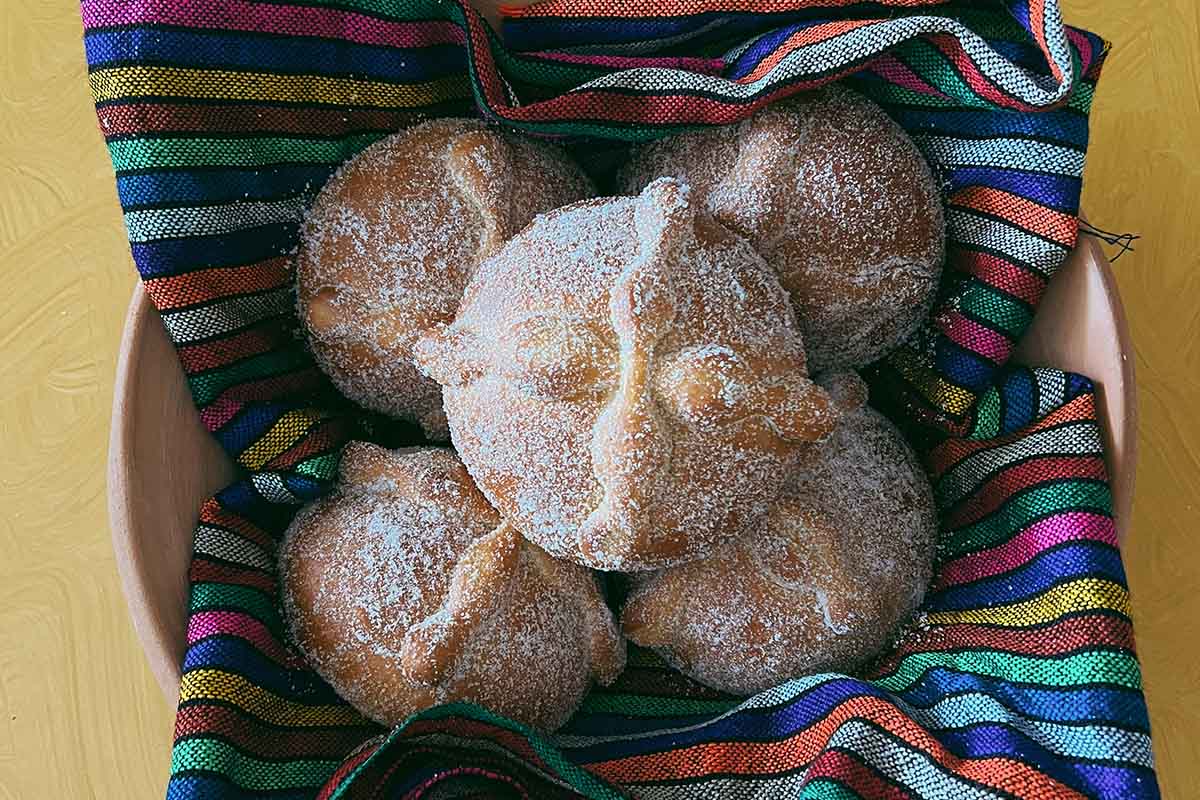 A basket of Pan de Muerto bread