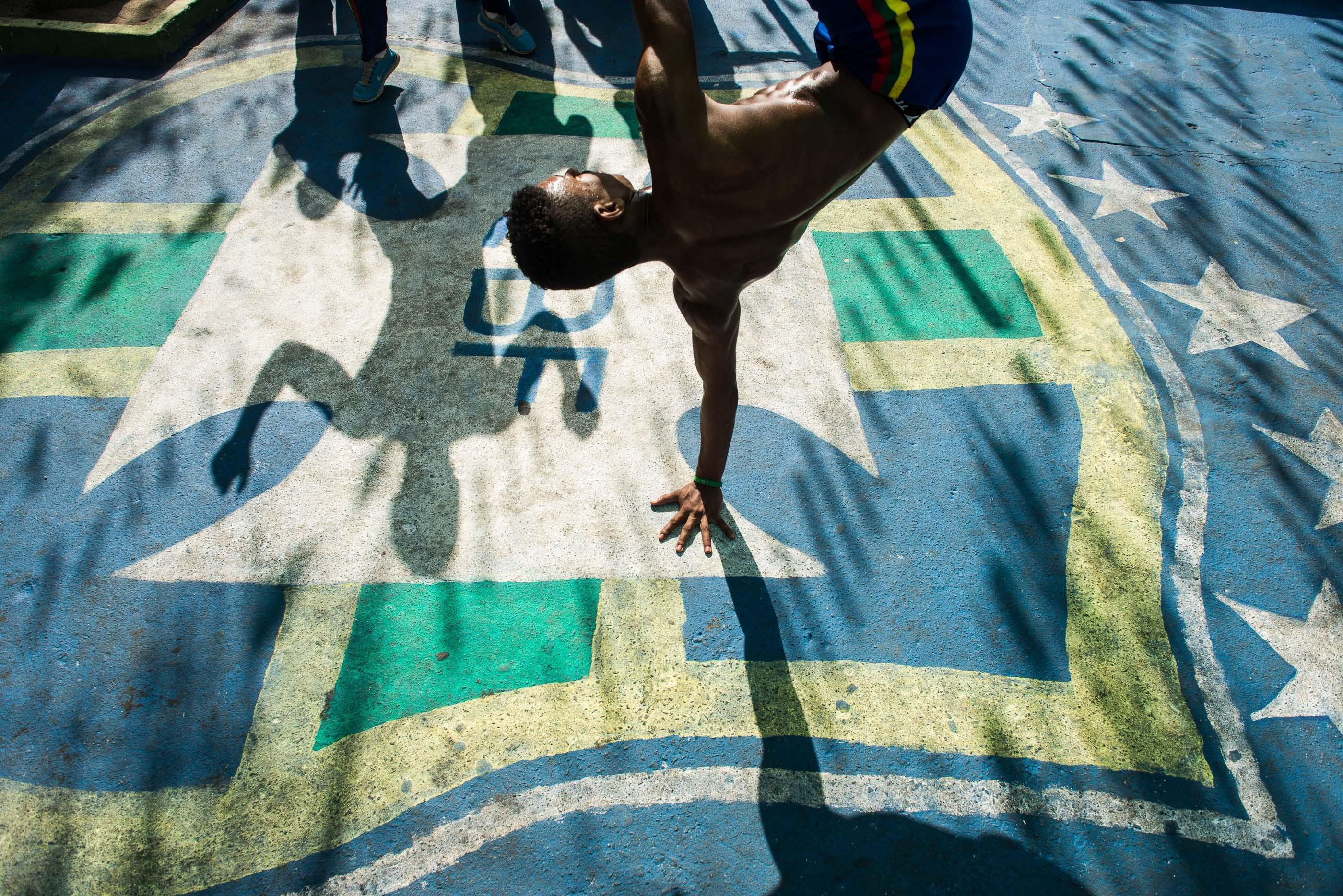 Capoeira artists performing on the street in Rio. We spoke with Capoeira master Neguin about the history of the practice.