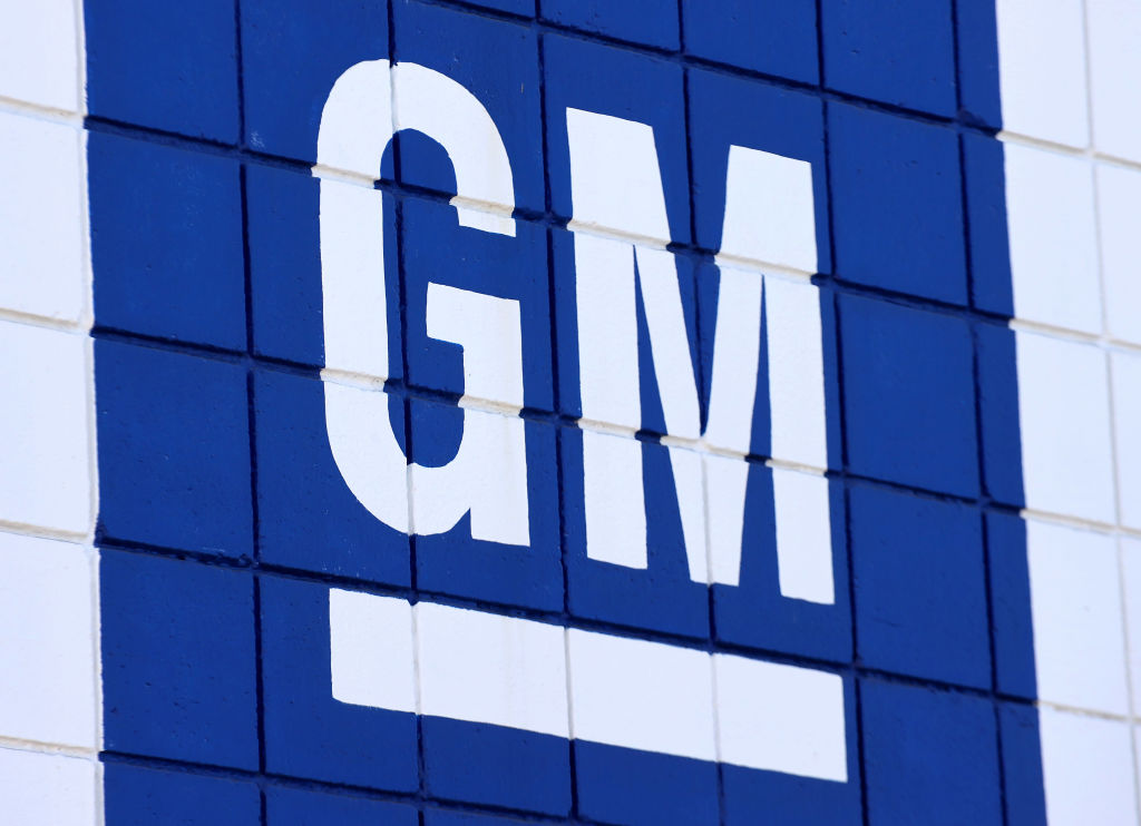 The General Motors logo in blue and white on a Chevrolet dealership. GM paused paid advertising on Twitter after Elon Musk's takeover of the social media platform.