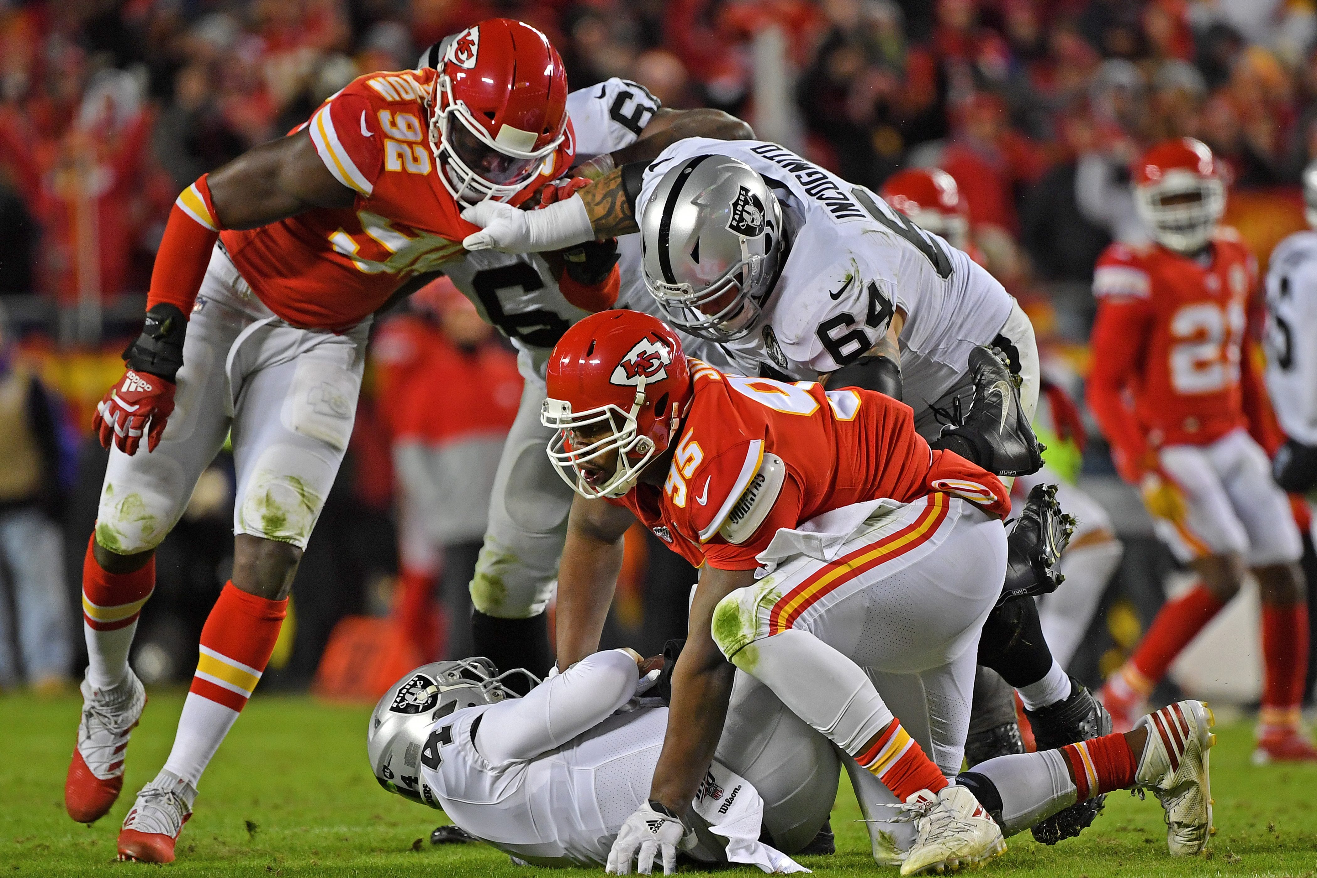 Chris Jones of the Kansas City Chiefs sacks Las Vegas Raiders quarterback Derek Carr.