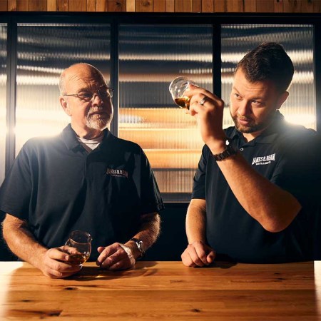 Master Distillers Fred and Freddie Noe of Jim Beam examining whiskey. The two distillers discussed the future of bourbon.