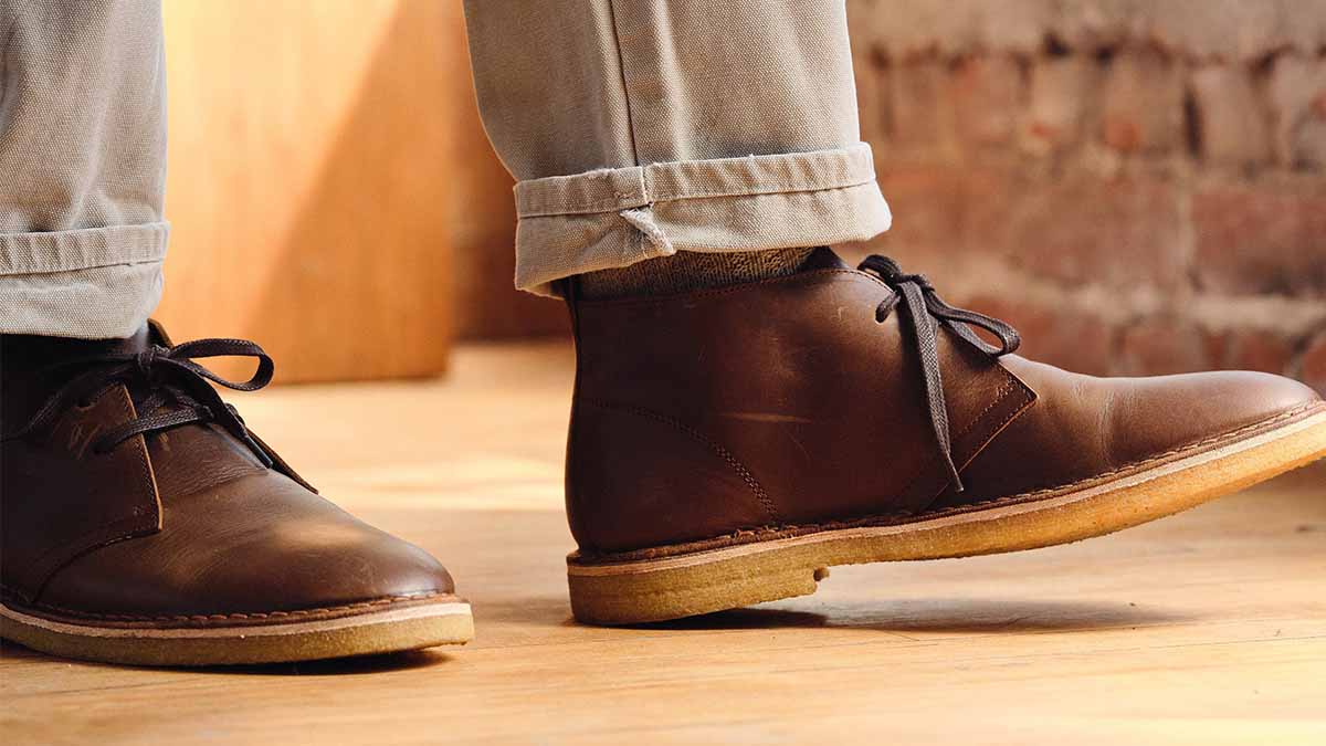 A man walking in Mason Chukka boots by Rhodes Footwear, now on sale at Huckberry