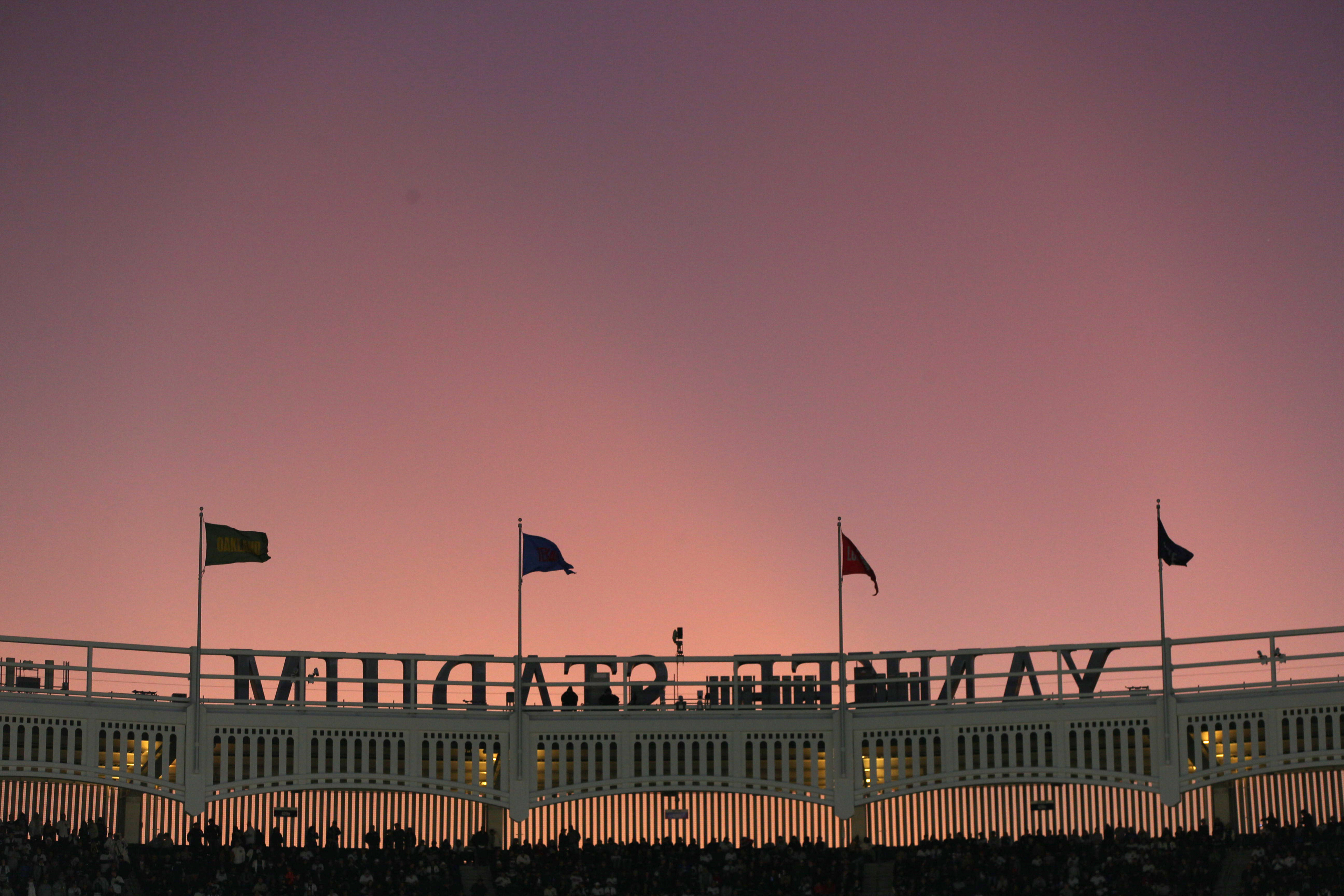 Sunset outside the frieze at Yankee Stadium. Here's why the New York Yankees need to have a losing season.