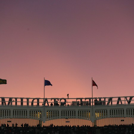 Sunset outside the frieze at Yankee Stadium. Here's why the New York Yankees need to have a losing season.