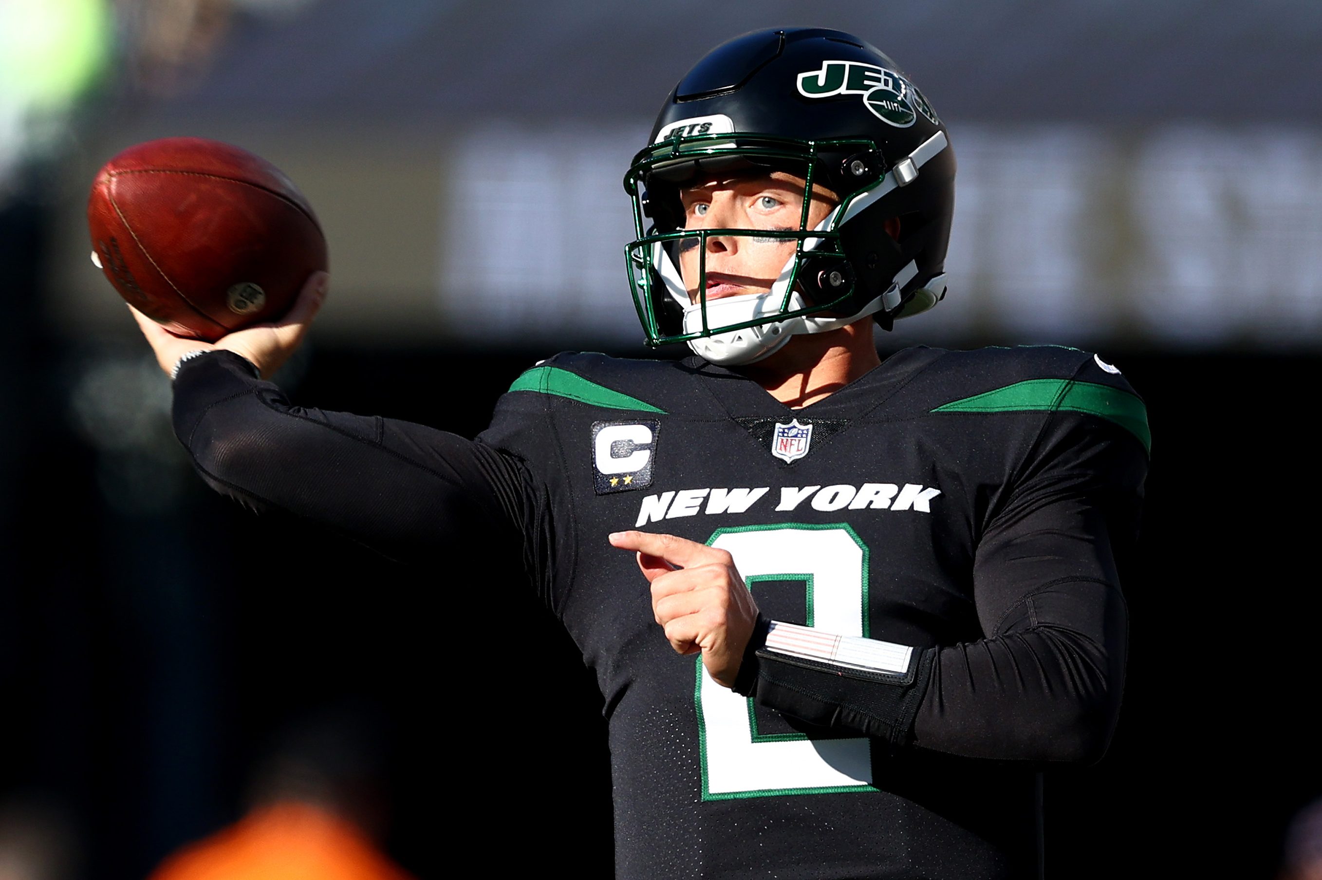 Zach Wilson of the Jets throws the ball against the New England Patriots.