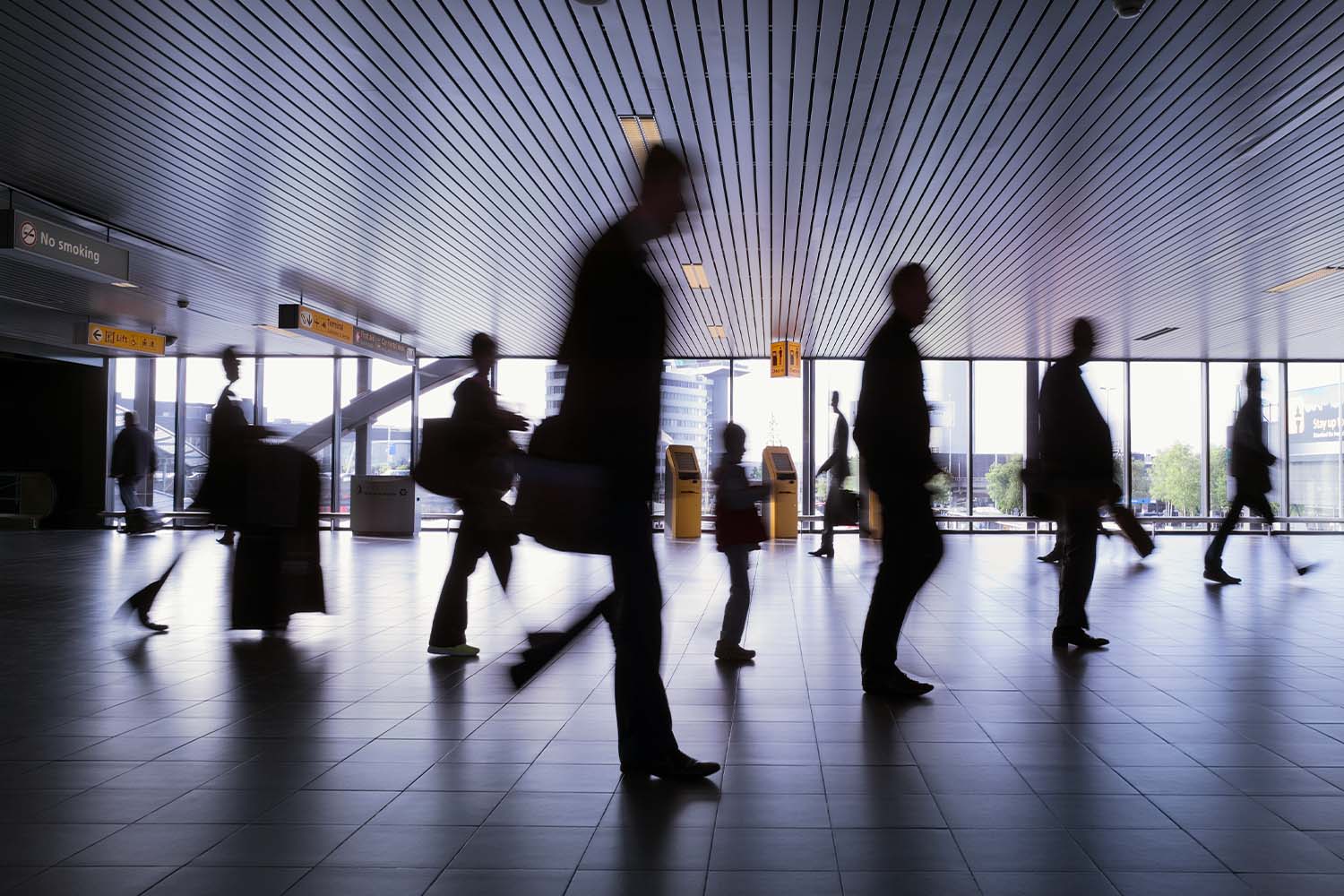 Silhouette of group of travelers at Schiphol Airport in Amsterdam