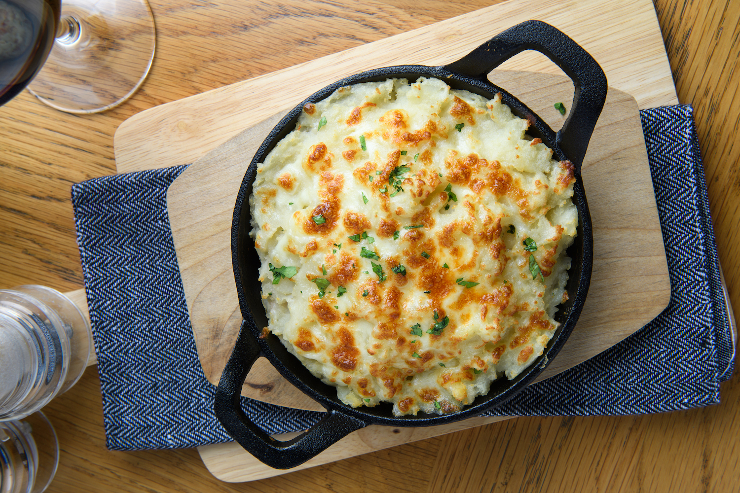 Overhead view of cottage Pie with leftover turkey in a cast iron pan