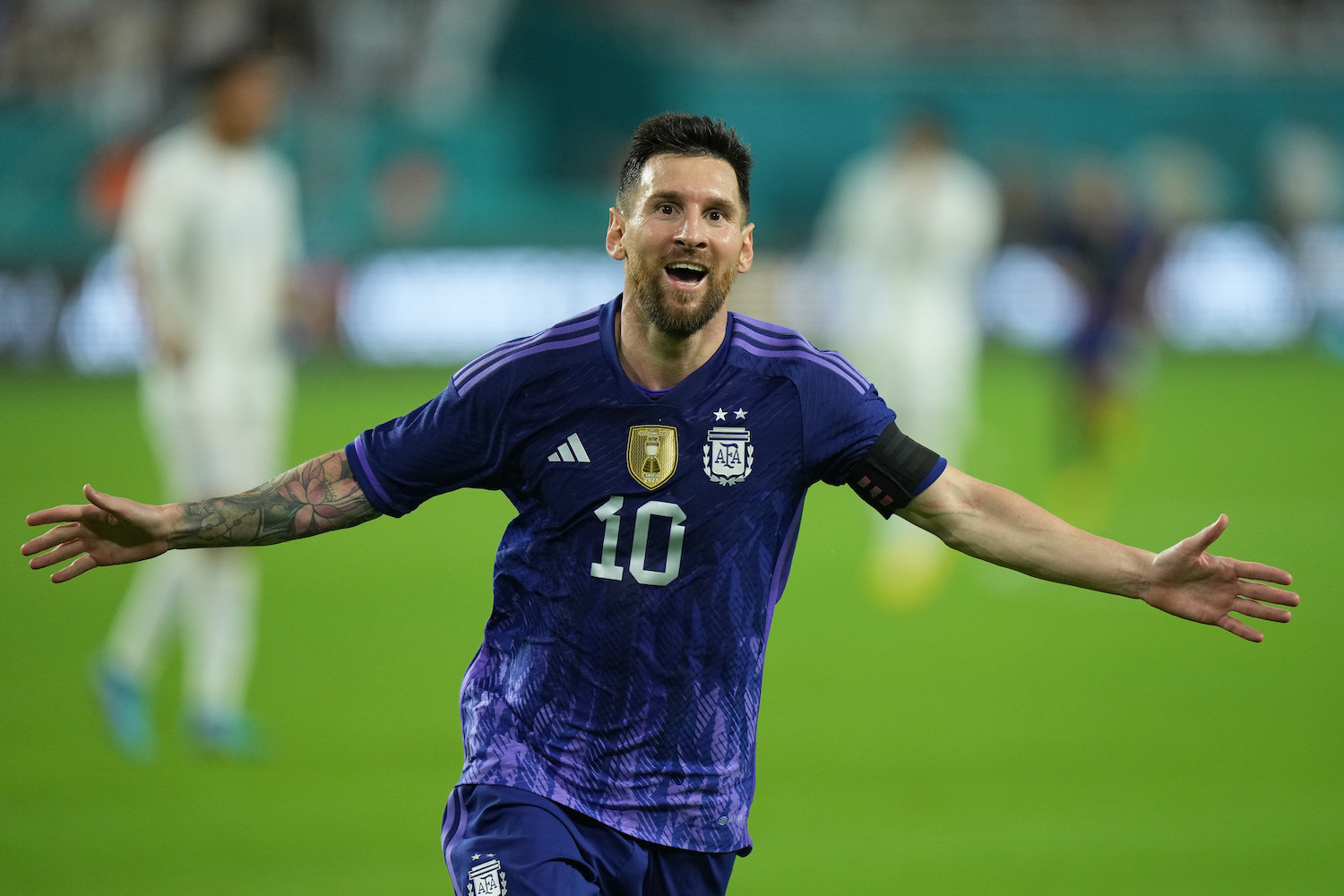 a soccer player in a purple jersey