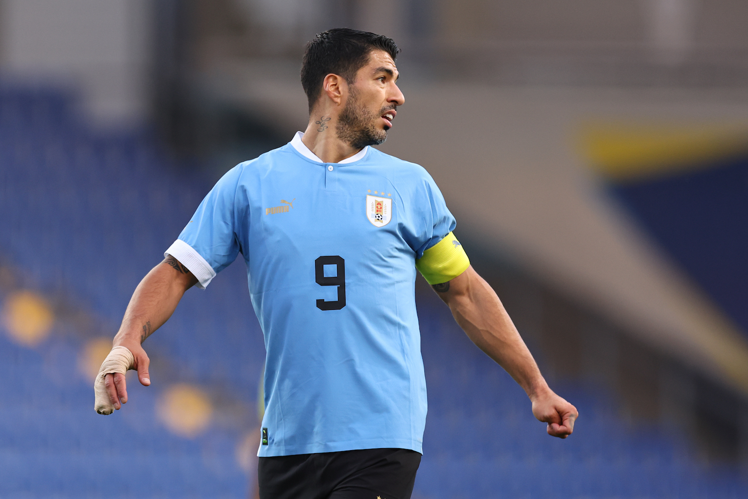 a soccer player in a blue jersey