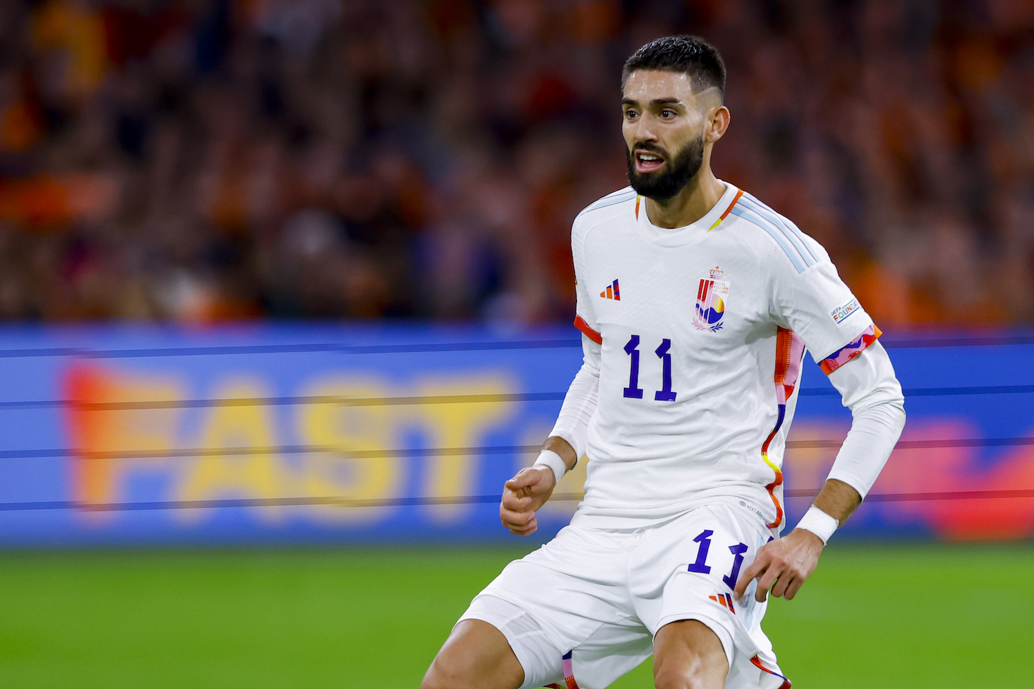 a player in a white soccer jersey