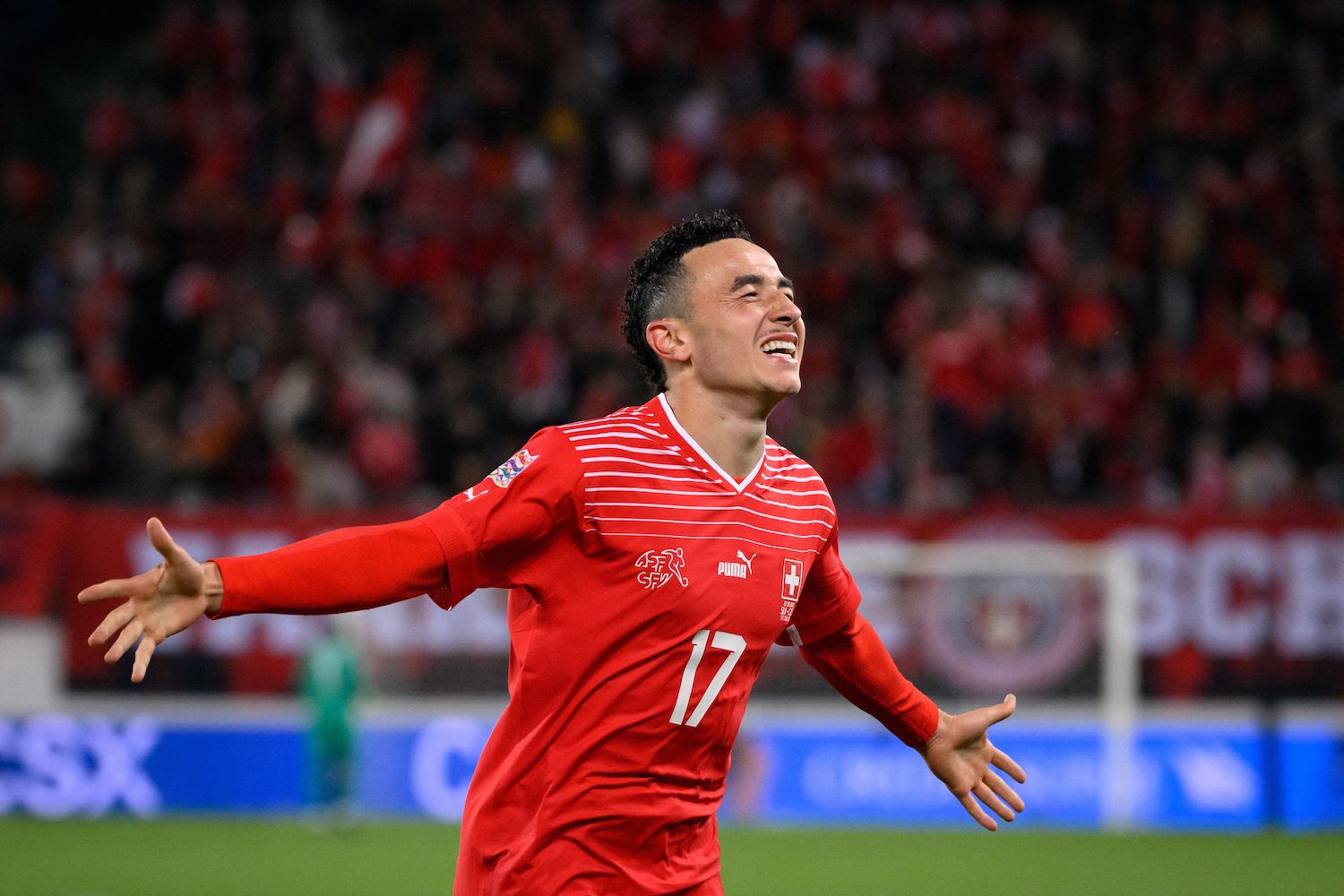 a soccer player in a red soccer jersey