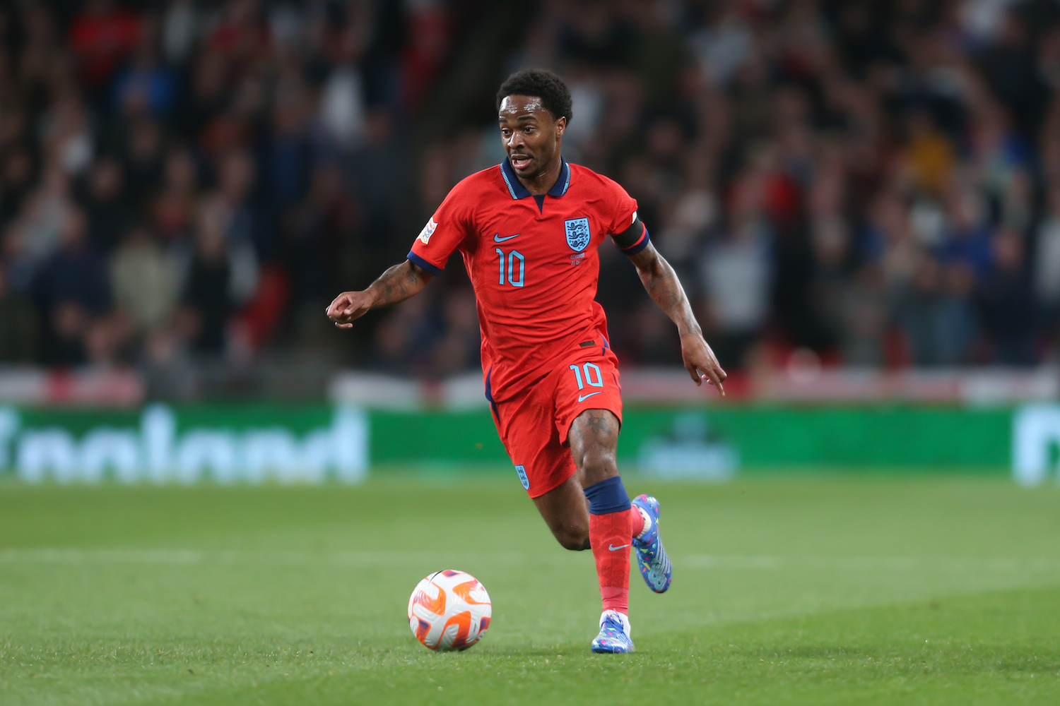 an english soccer player in a red jersey