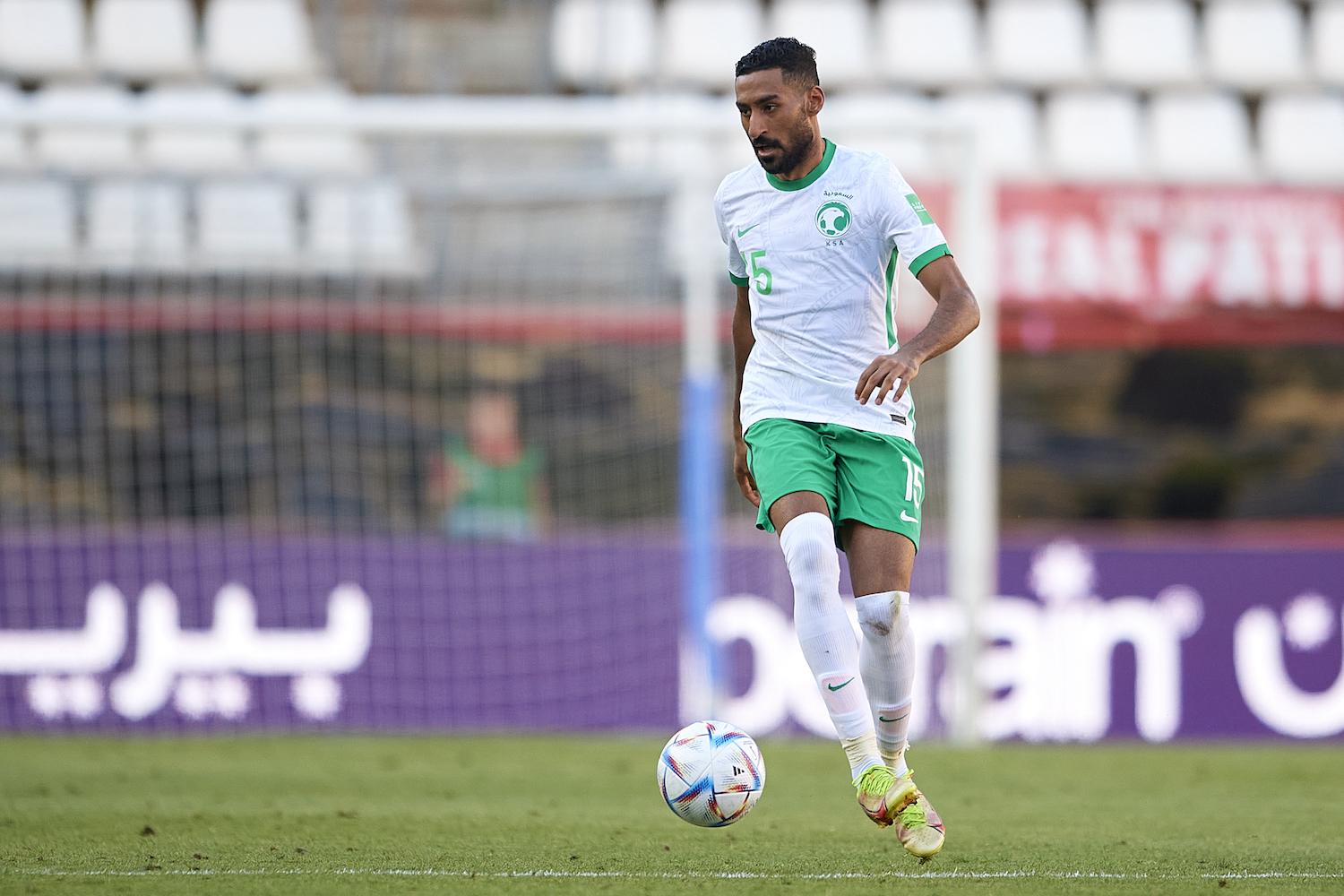 a soccer player in a white jersey