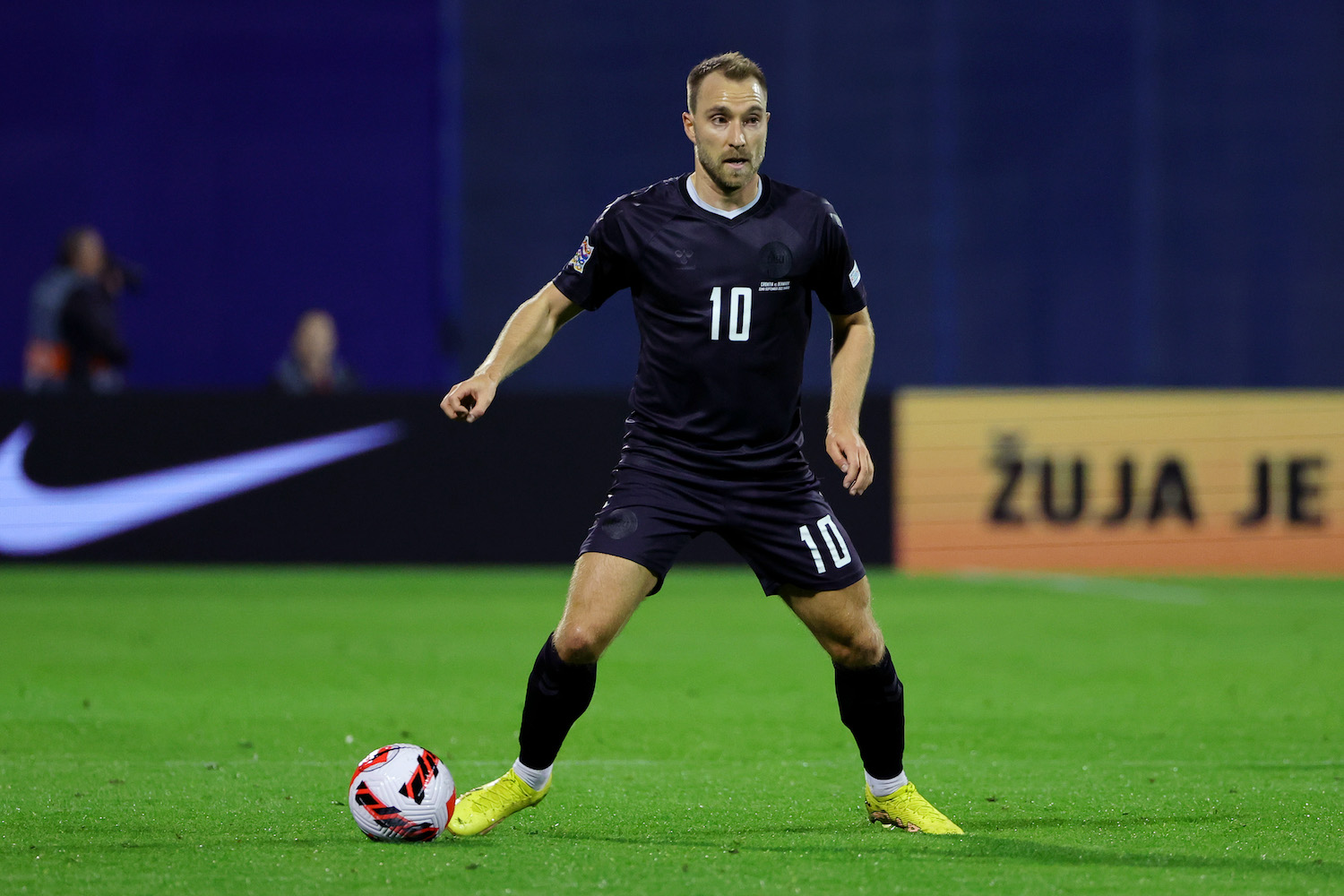 a danish soccer player in a black jersey