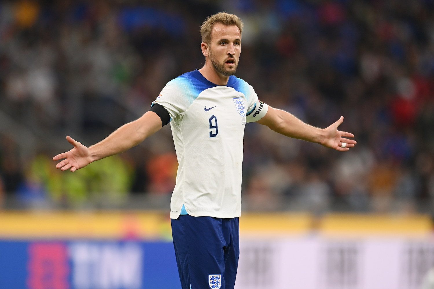 a player in a white soccer jersey