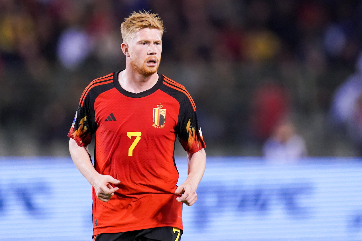 a soccer player in a red jersey