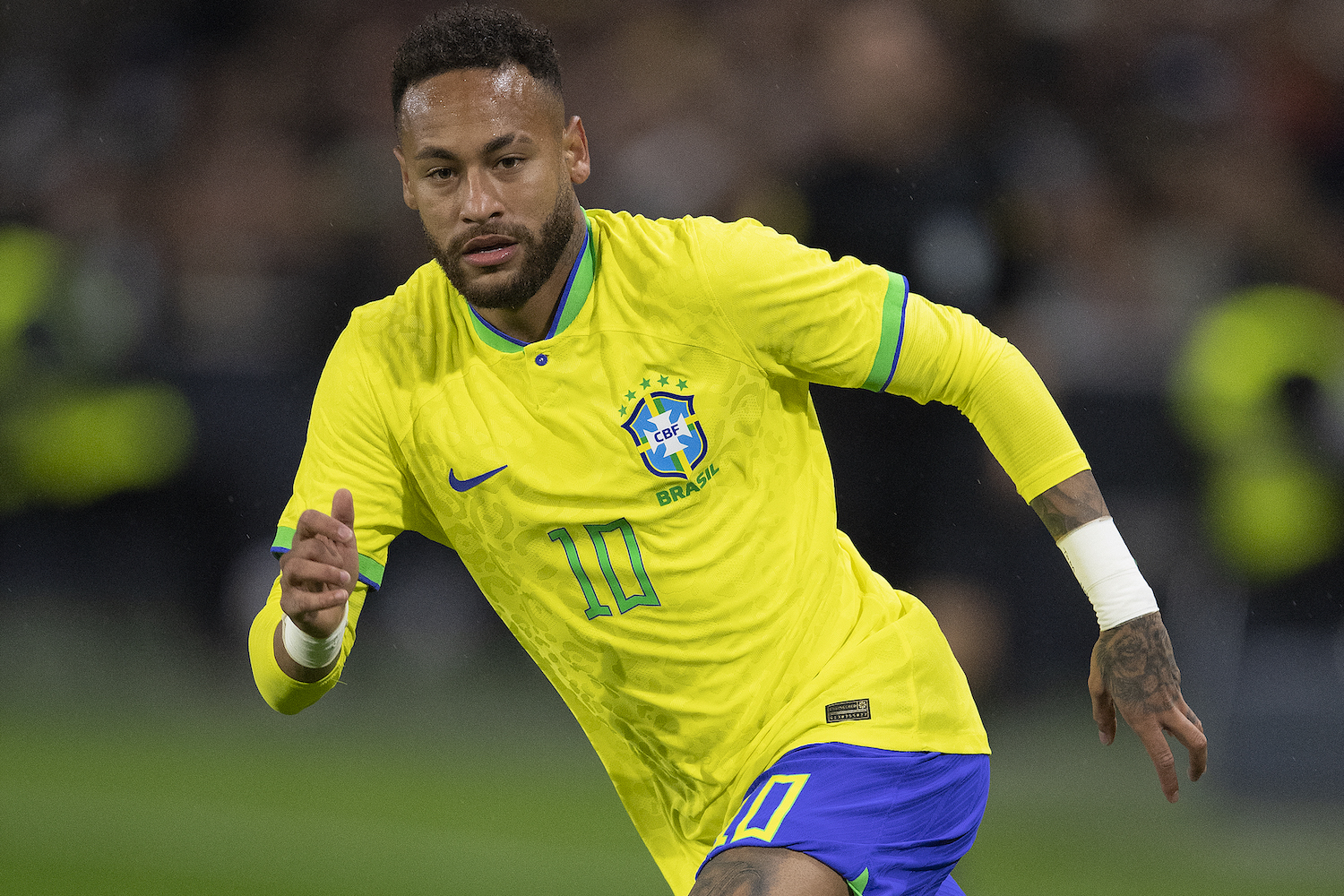 a Brazilian soccer player in a yellow soccer jersey