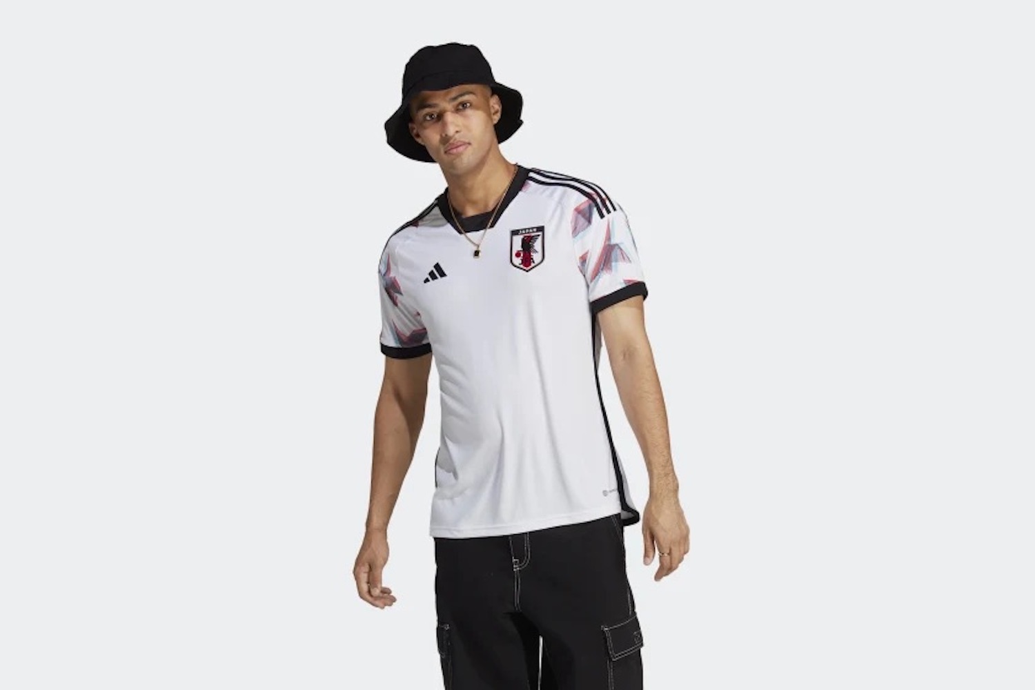 a model wearing the white Japan away kit