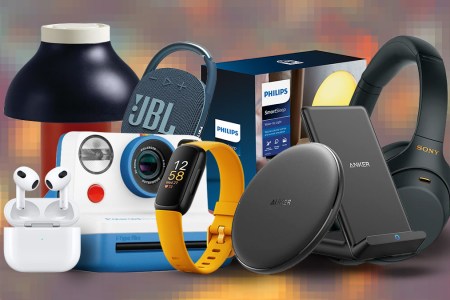 Tech gifts from JBL, Polaroid, Anker and Fitbit on a colored background