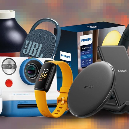 Tech gifts from JBL, Polaroid, Anker and Fitbit on a colored background