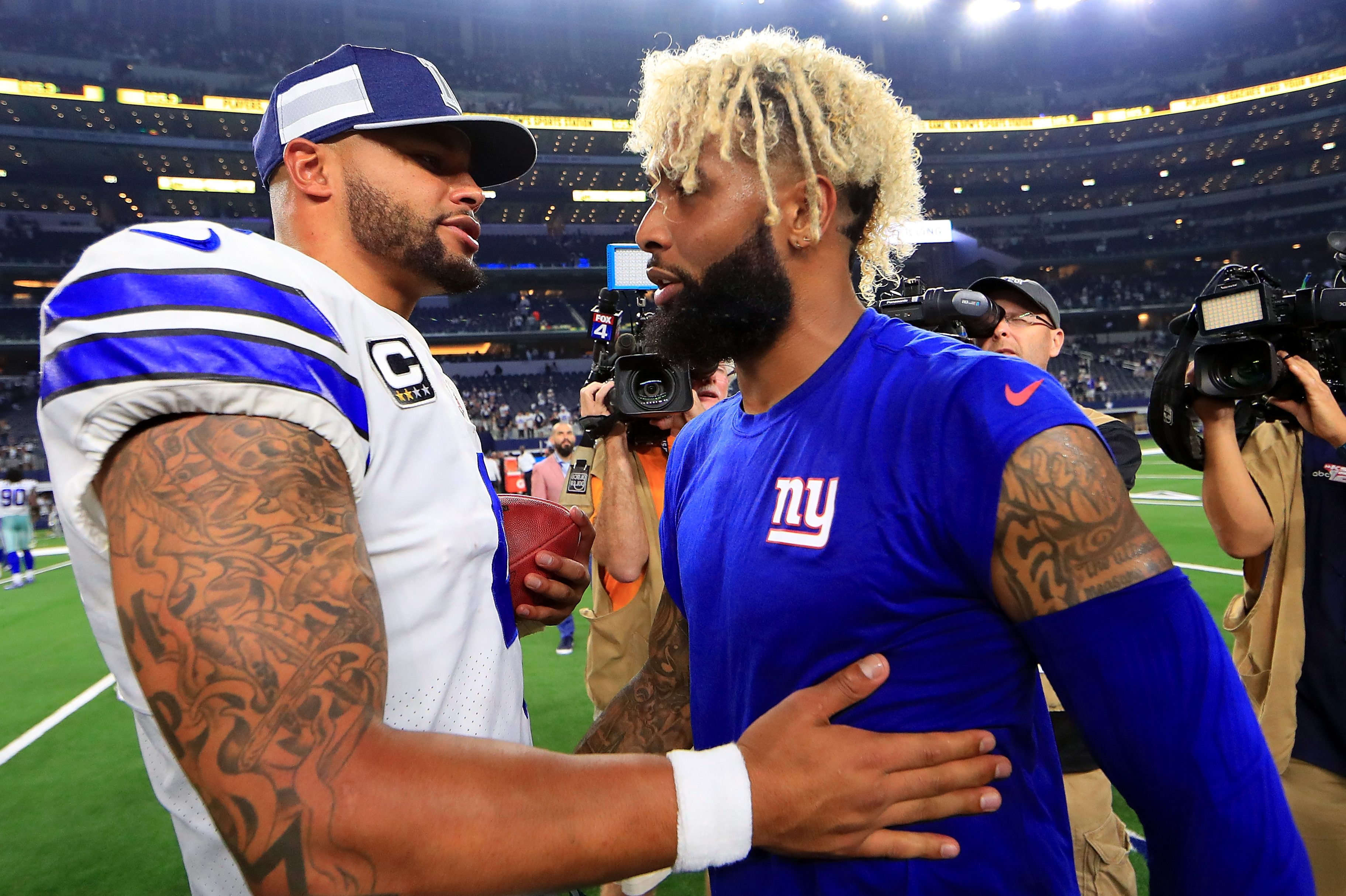 Dak Prescott of the Cowboys greets Odell Beckham Jr. in 2018.