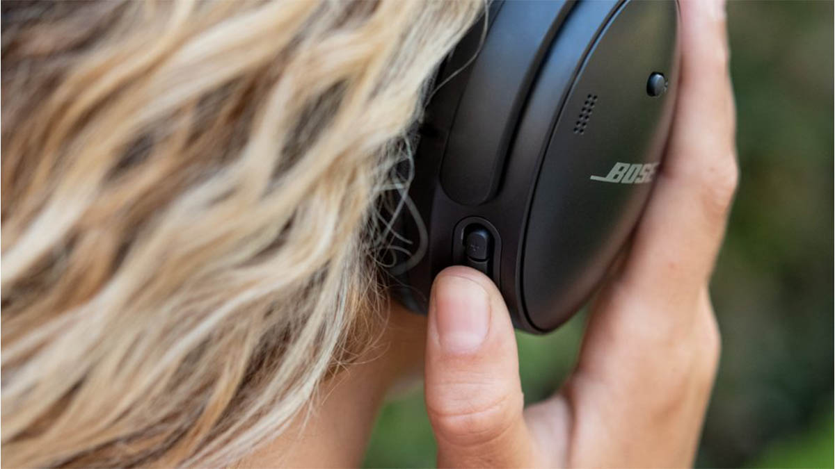 A person wearing Bose headphones, close-up. Bose's Black Friday sale has started early