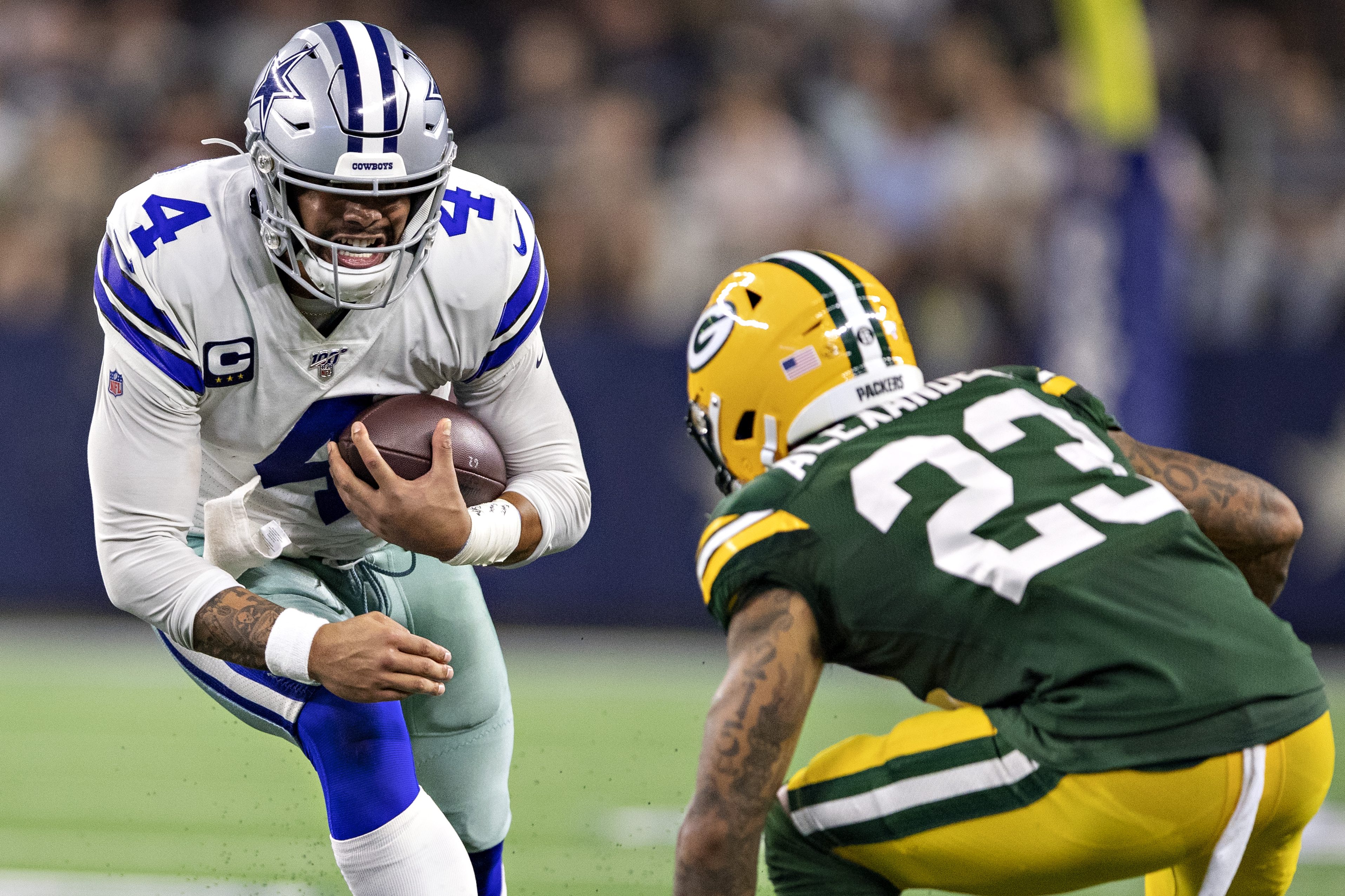 Dak Prescott is hit by Jaire Alexander in 2019.