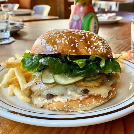 The Exchange’s White Cheddar Cheeseburger With Griddled Onions And Confit Tomato Aioli