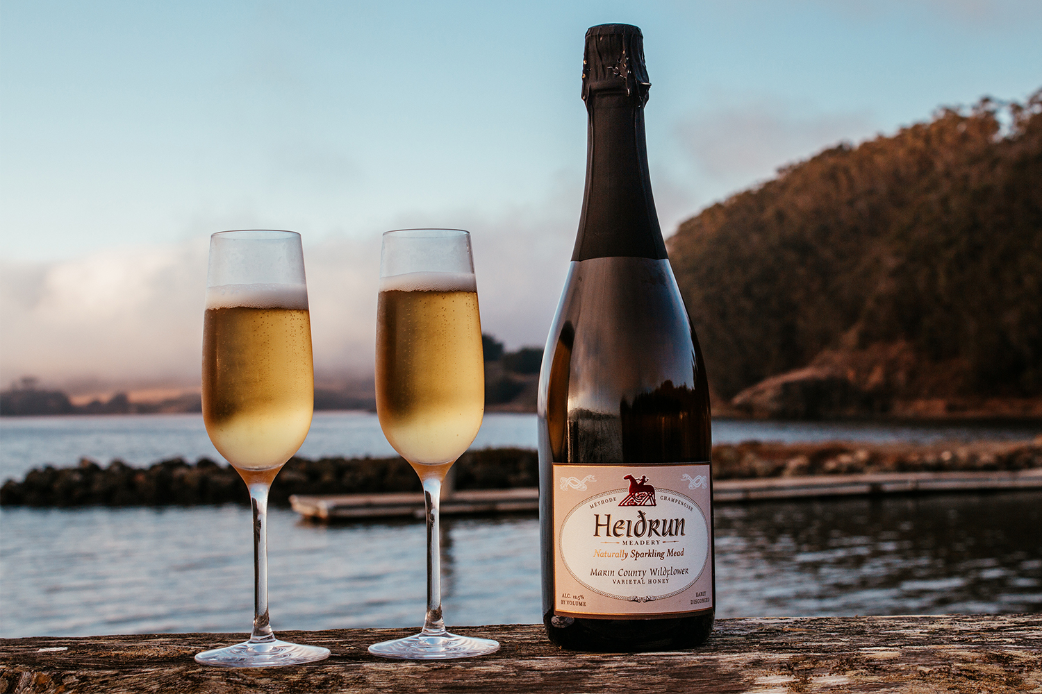 A bottle of Marin County Wildflower mead from Heidrun Meadery sits next to two full glasses of the booze